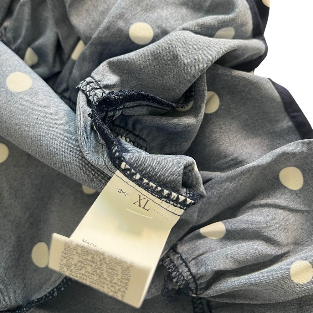 Navy and white sleeveless polkadot dress with ruffle bottom - Picture 7 of 7